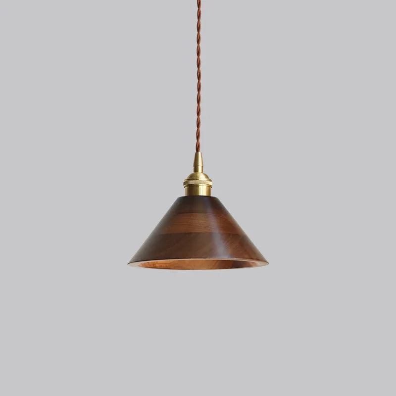 Black walnut and copper single-head droplight chandelier suspended from a ceiling.