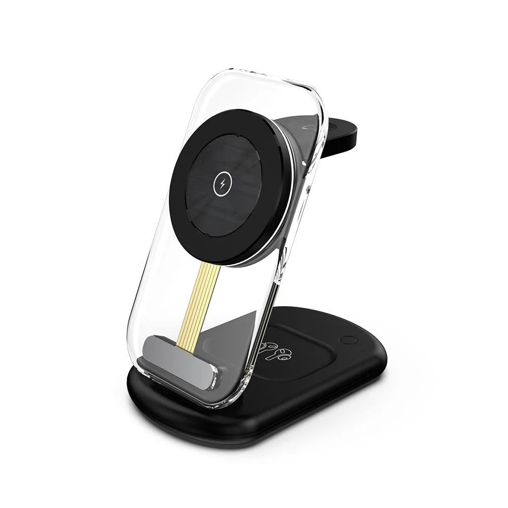 Transparent folding magnetic three-in-one wireless charger showing internal coil, in black, on a desk.