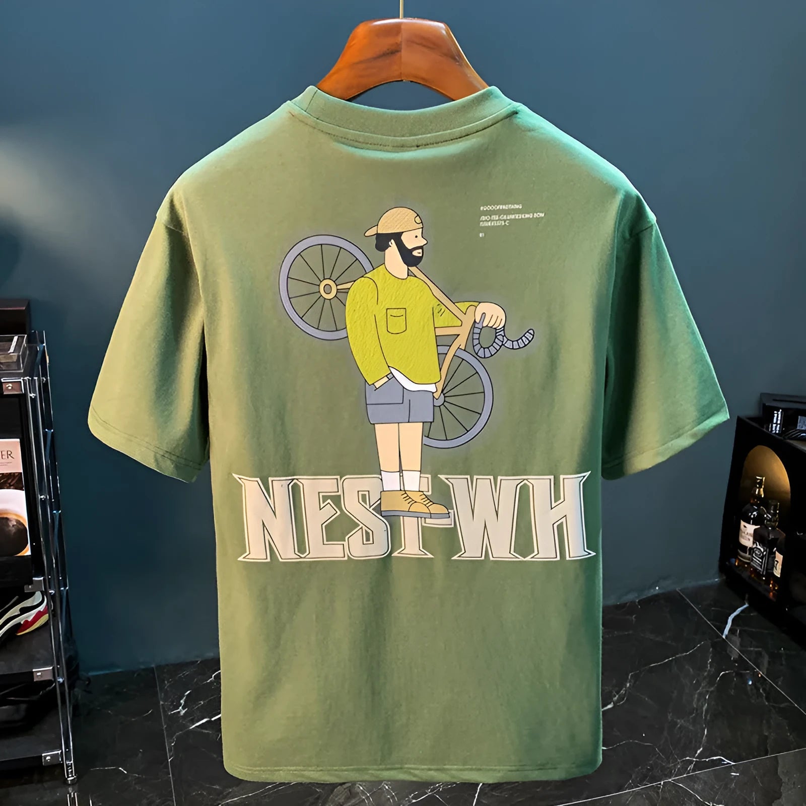Green printed men's T-shirt with loose fit short sleeves displayed in multiple size options