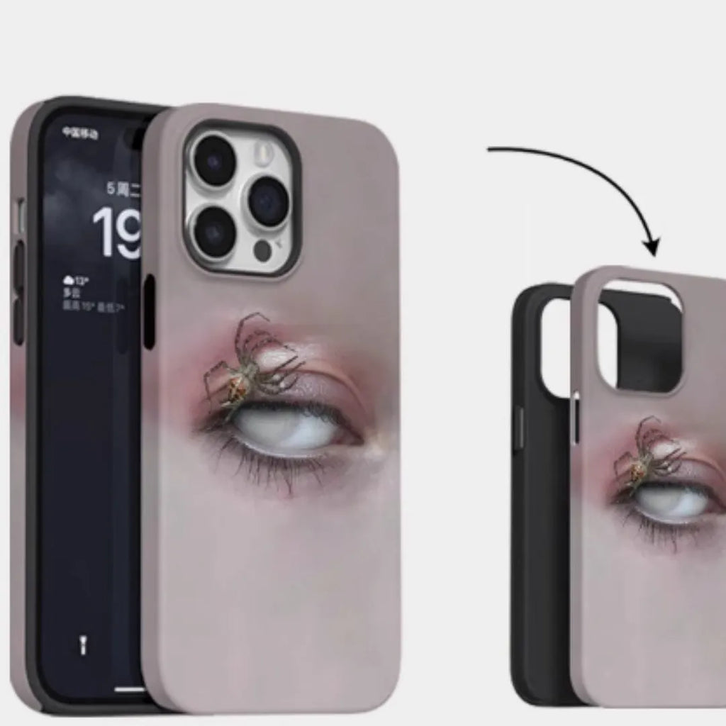 Dark heterochromatic spider design resin case for iPhone 15 Pro Max on a table