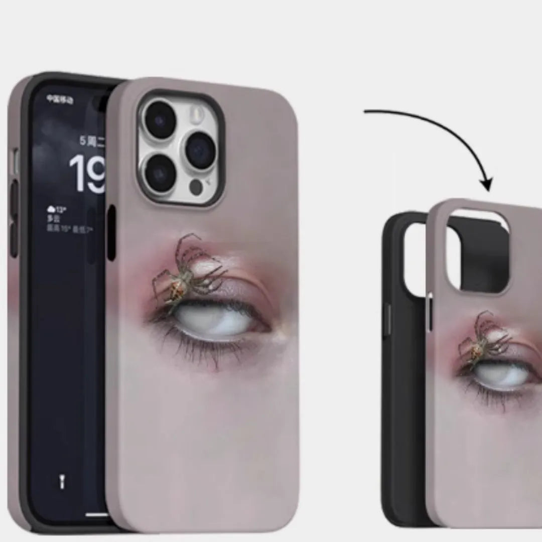 Dark heterochromatic spider design resin case for iPhone 15 Pro Max on a table