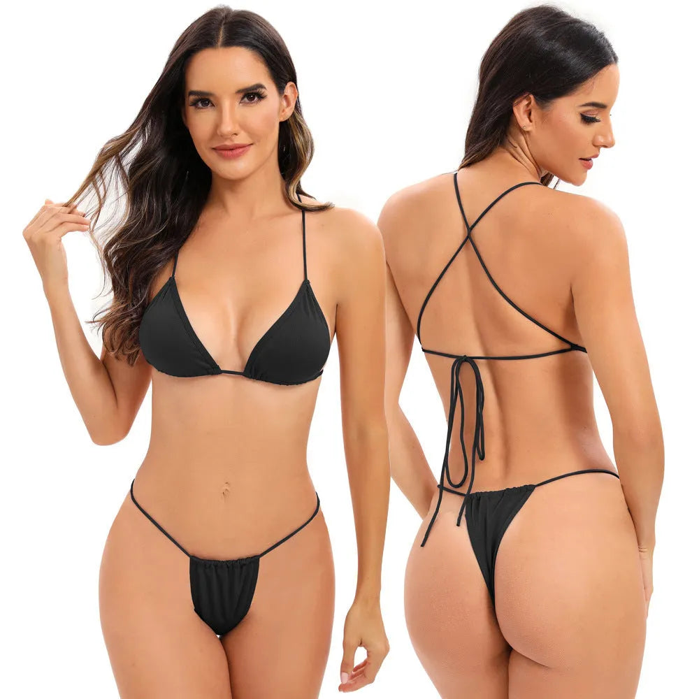 Women's candy coloured cross strap split swimsuit with multiple adjustable straps on a mannequin.