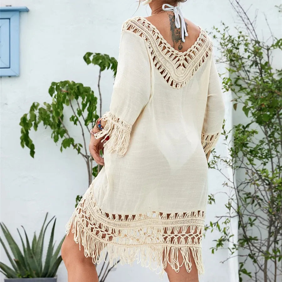 Apricot crocheted knitted patchwork beach dress with half sleeves on a hanger