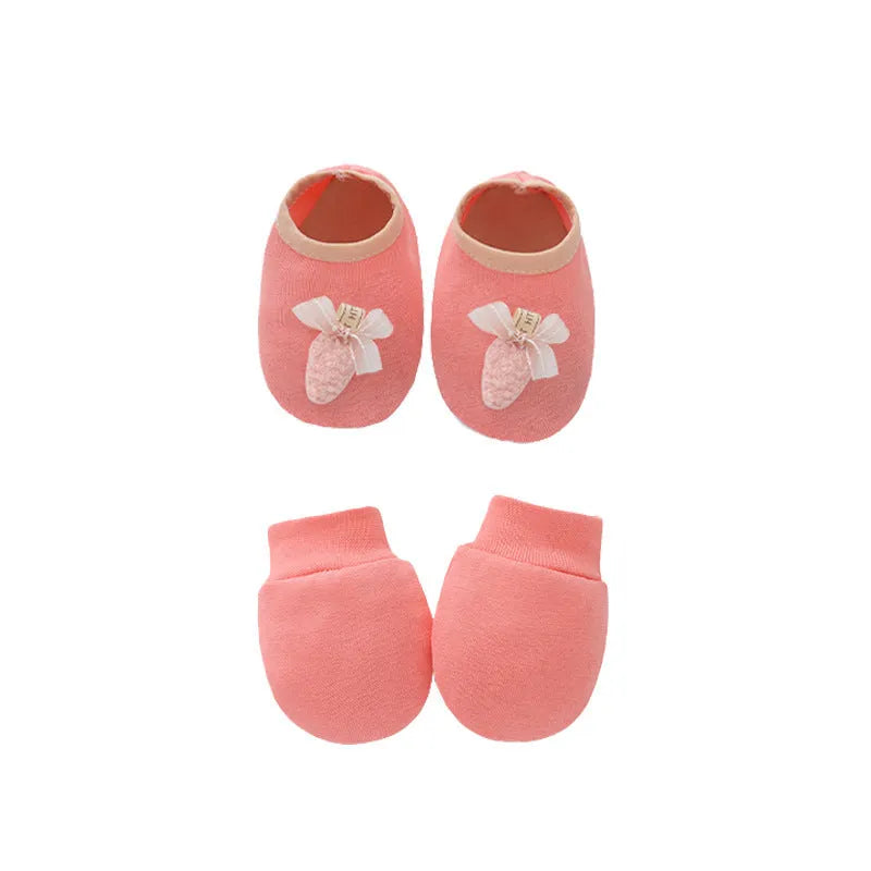 Set of white, light blue, and grey cotton baby pullover caps, gloves, and foot covers for infants.