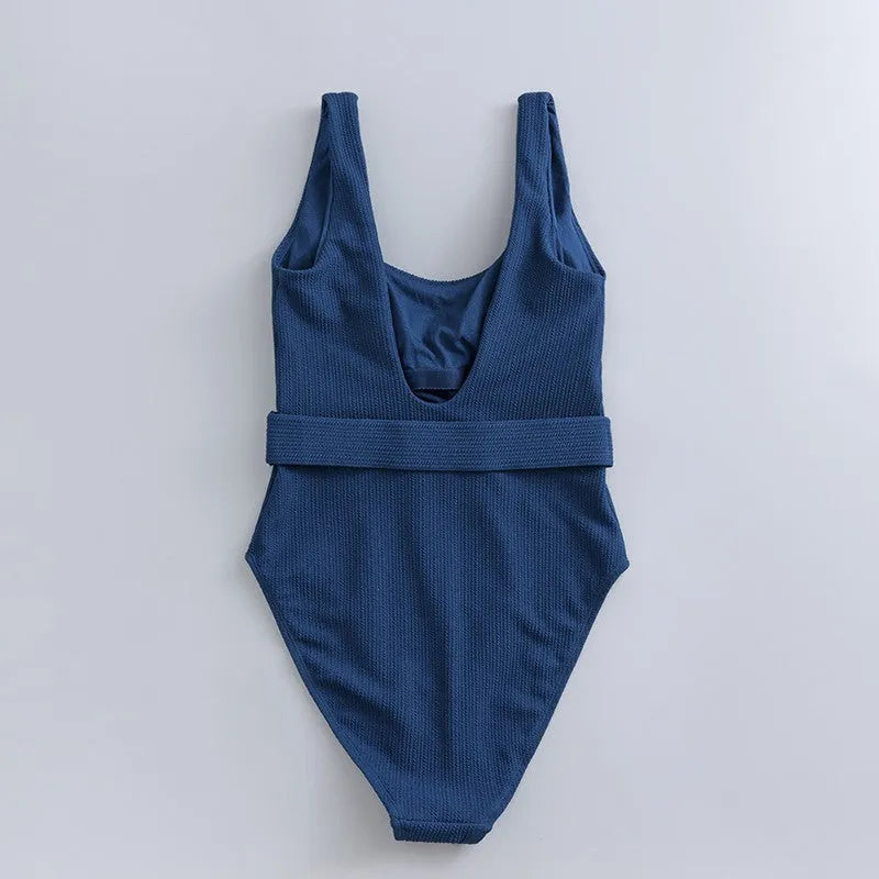 Navy blue women's one-piece swimsuit with triangle neckline and sleeveless design for swimming.