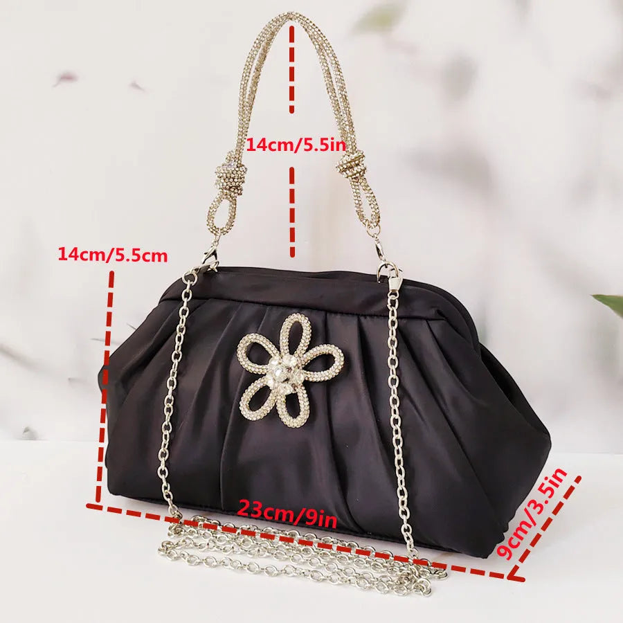 Soft lavender purple women's shoulder messenger bag with chain detail, shown in shell shape with folds.