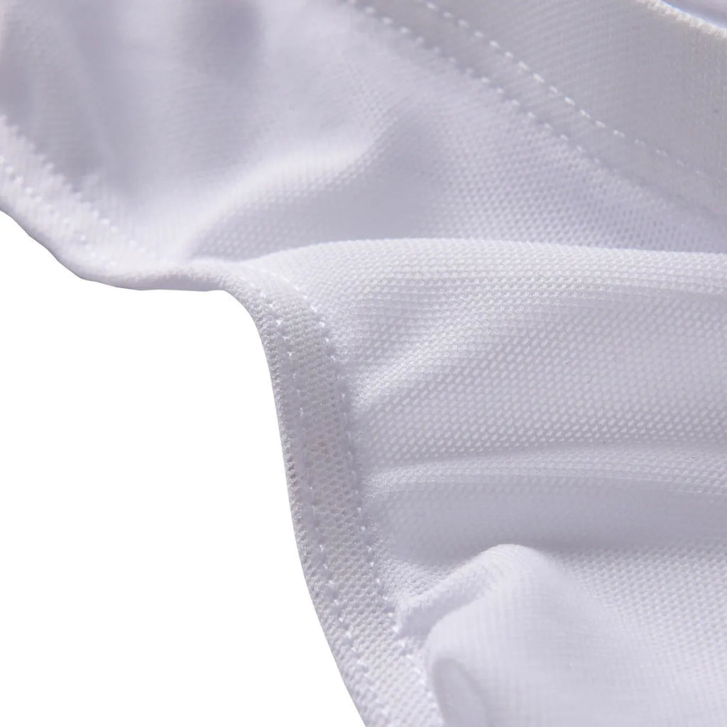 Men's black low-waist nylon briefs laid flat, showing brief-style cut and knitted fabric texture.