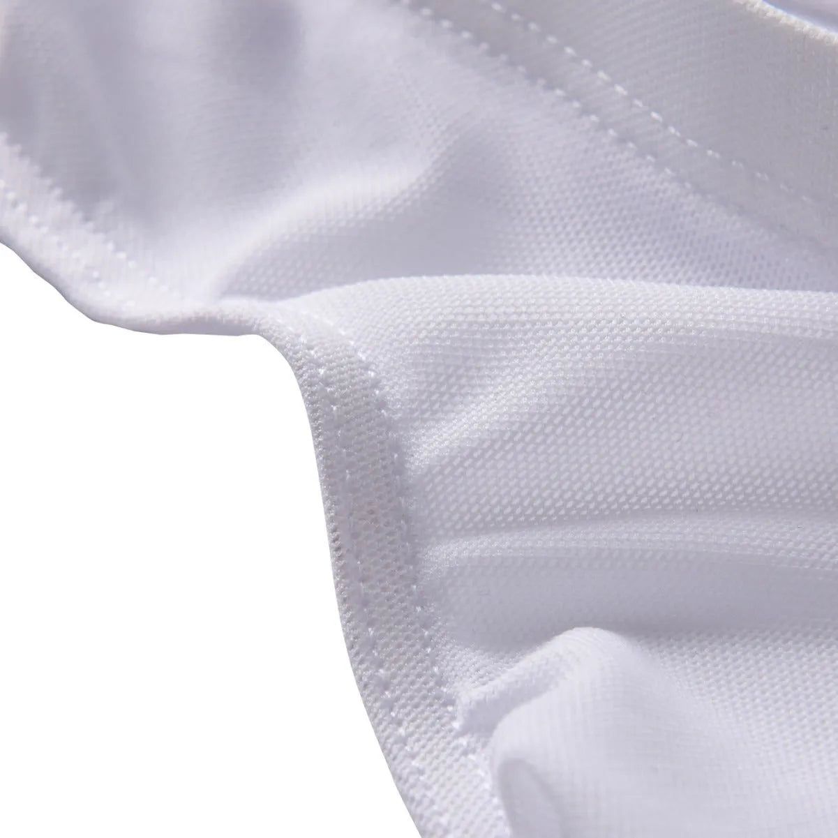Men's black low-waist nylon briefs laid flat, showing brief-style cut and knitted fabric texture.