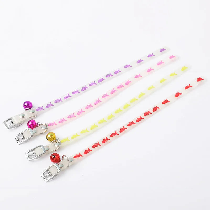 Luminous cat collar with glowing effect, silicone chain, metal bell, in a paw print pattern design.