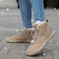 Waterproof unisex snow boots in black, khaki, or pink with round toe and front lace-up.
