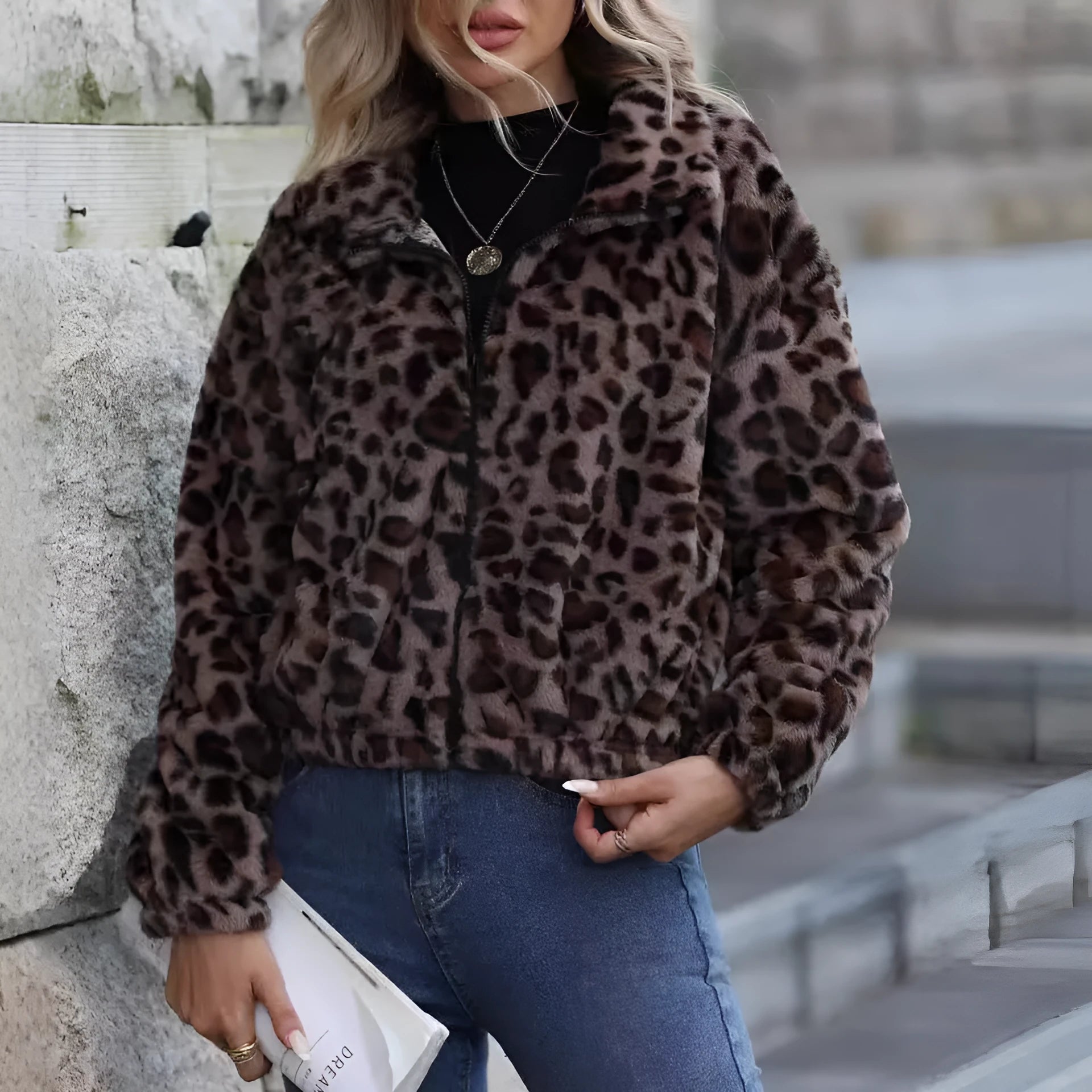 Women's loose long sleeve leopard print plush coat with full zip on a hanger