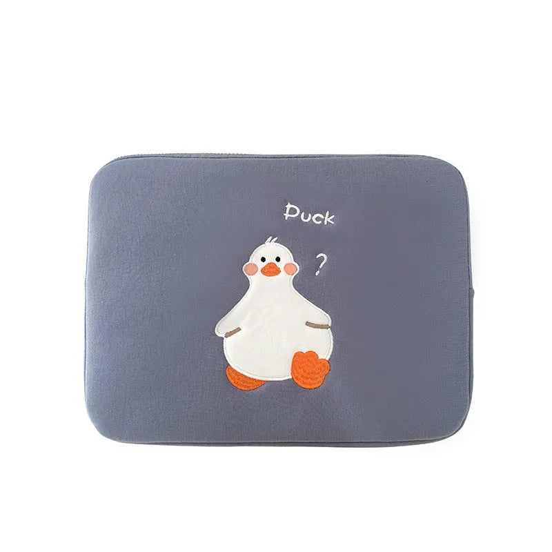 Blue cotton tablet case with embroidered cartoon duck design, showing zipper closure and protective frame.