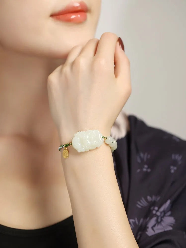 Hetian jade zodiac bracelet on red rope with S925 silver card for Chinese birth year animals.