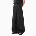 Women's black high-waist straight-leg jeans with retro gold wash detailing on denim.