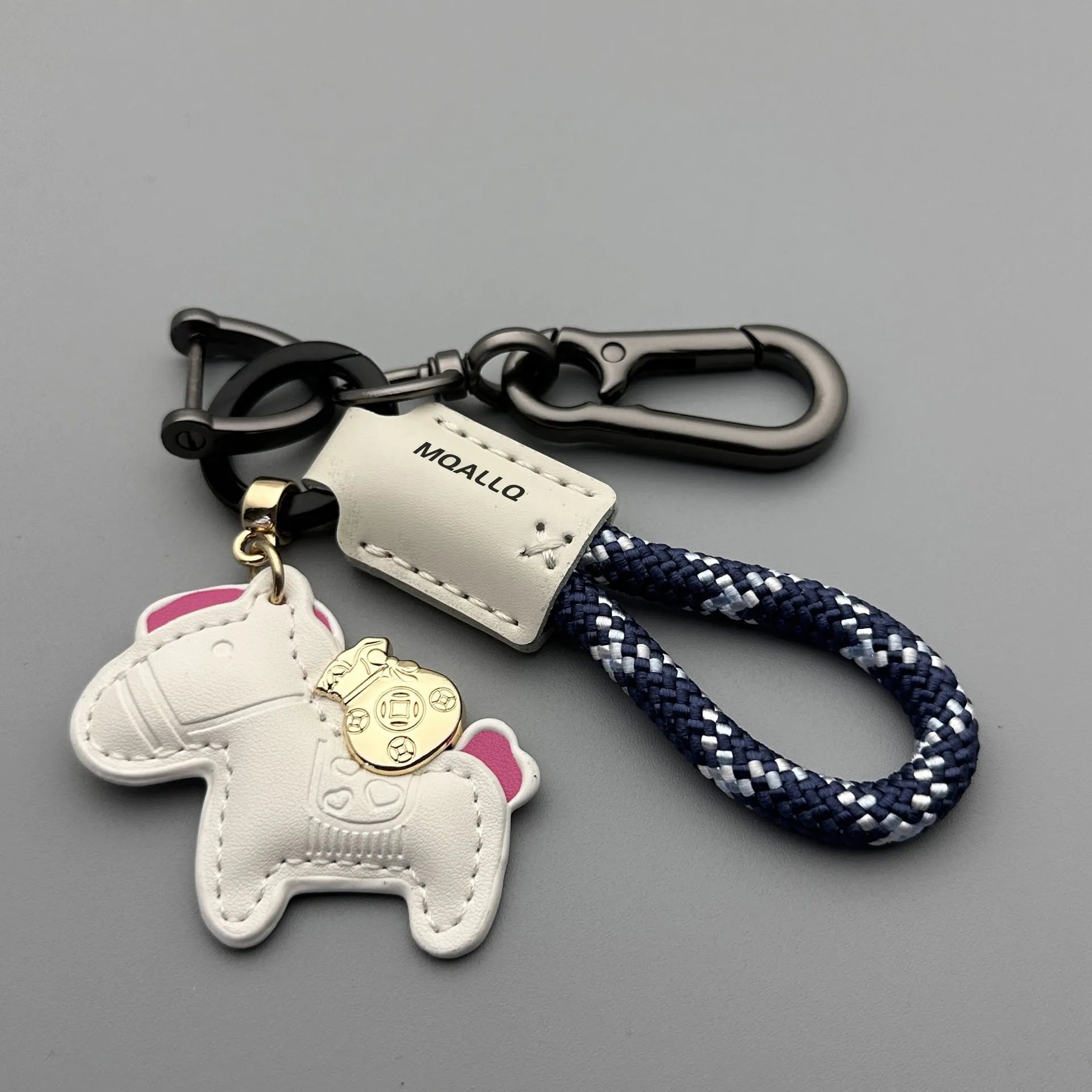 Handmade brown cowhide key ring pendant with a zinc alloy pony belt buckle and green flanelle rope.