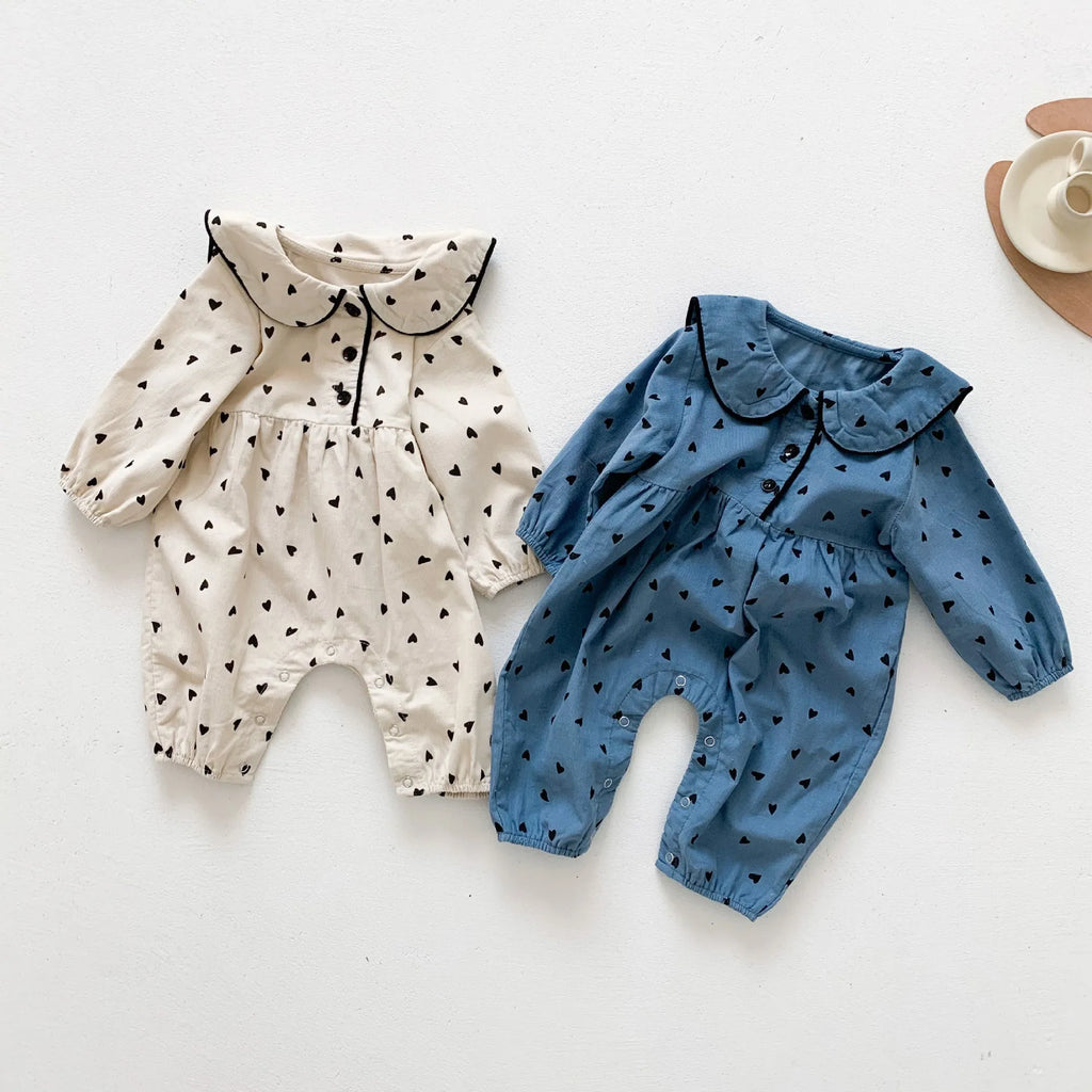 Baby onesie autumn corduroy long sleeve neutral gender beige infant bodysuit on white background