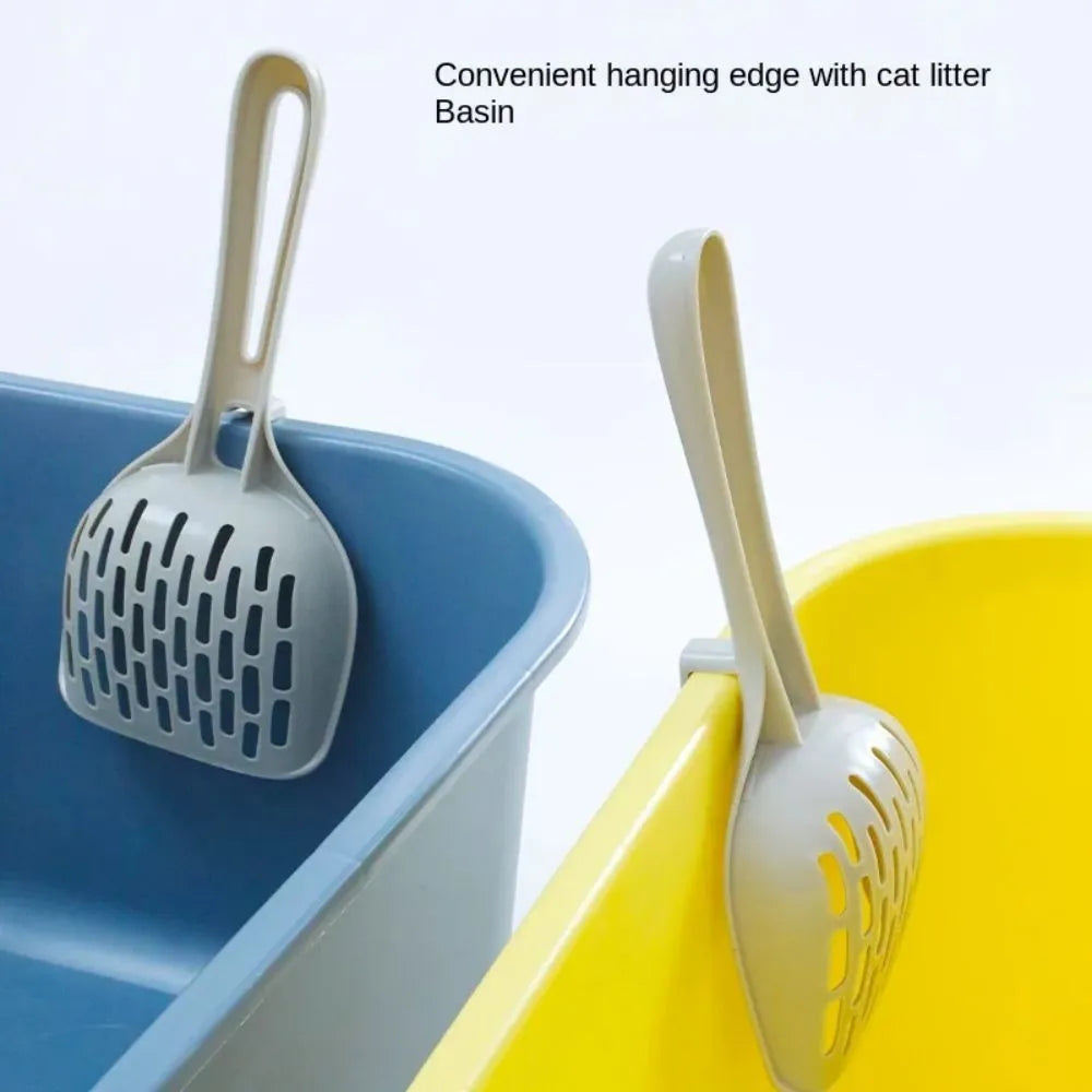 Grey plastic cat litter scoop with storage base showing self-cleaning slots and ergonomic handle