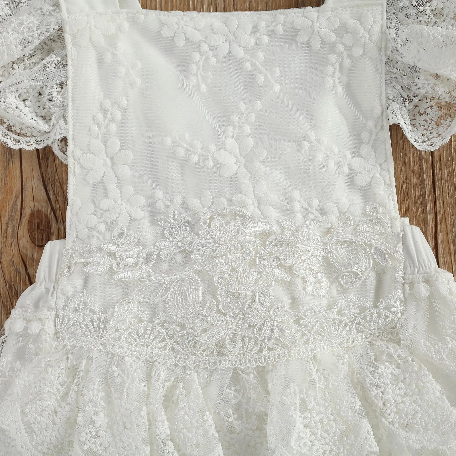 White 100% polyester baby bodysuit for Christmas, shown in real product photography.