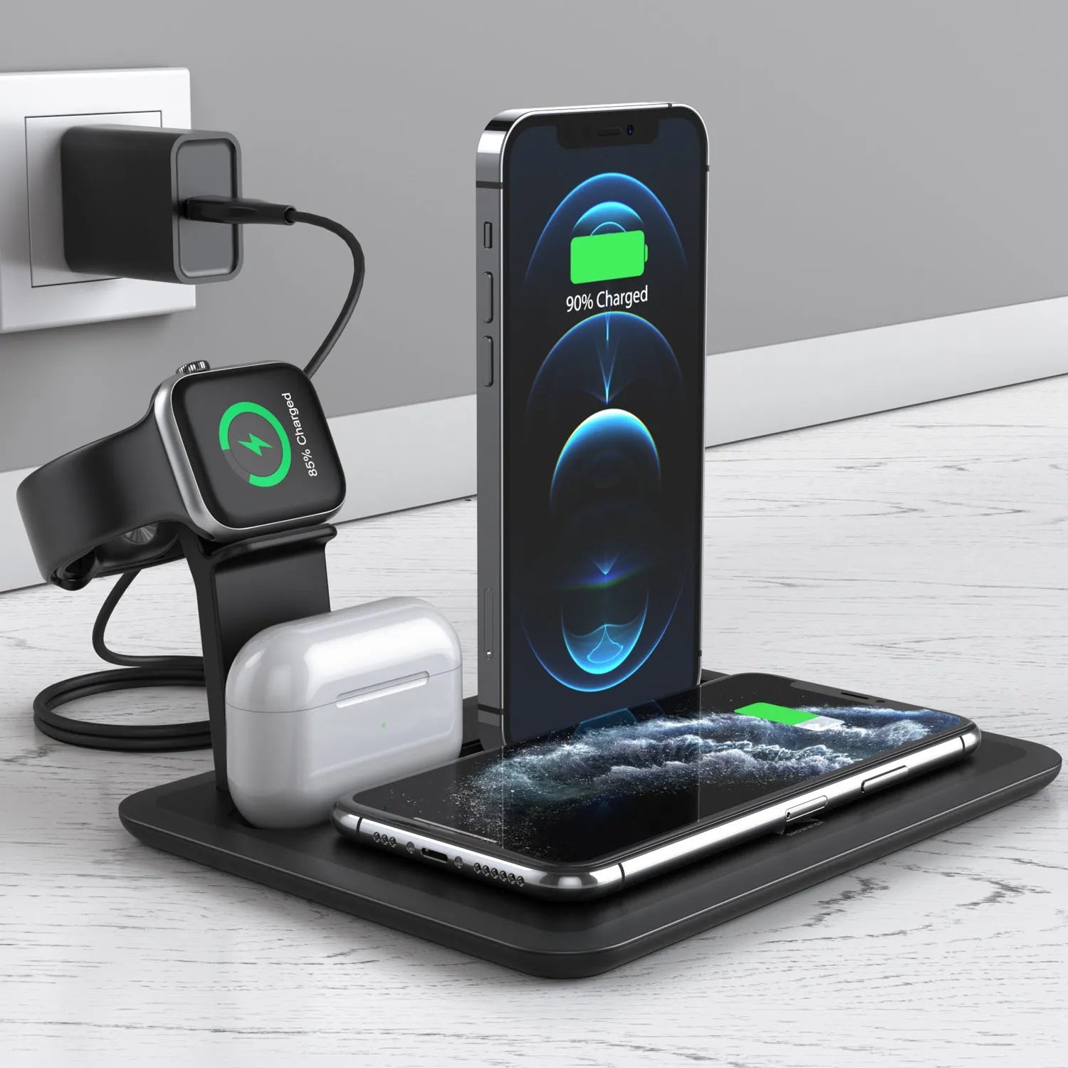 Black desktop charging hub showing wireless phone pad, USB port, watch port, and headphone charging dock.