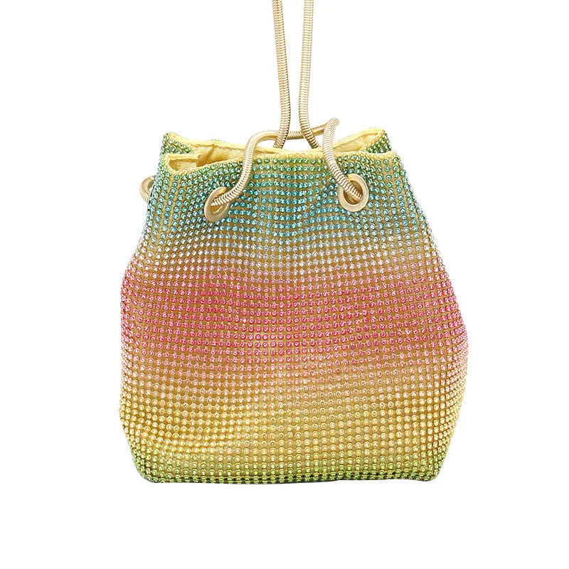 Rainbow coloured soft bucket handbag covered entirely in sparkling rhinestones with a top handle.