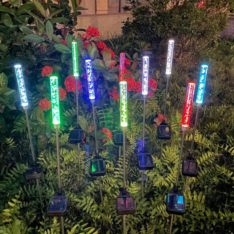 Solar bubble stick lawn lamp with colourful slow flash crystal bubble effect in garden setting