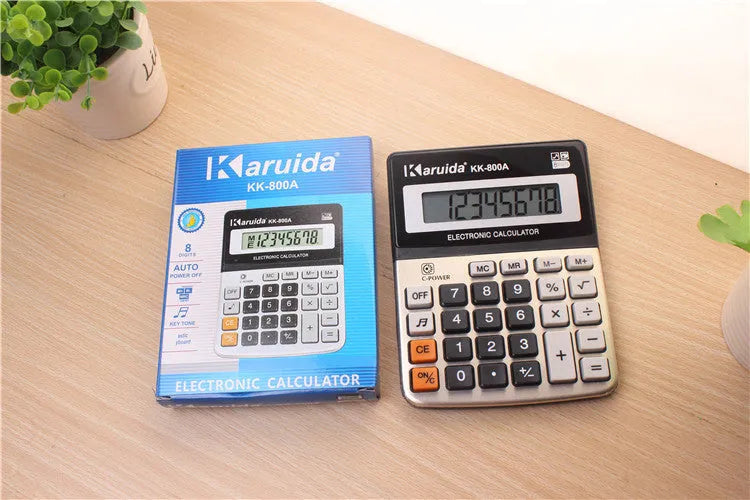 Silver aluminium desktop calculator with compact 14.5x11cm size on desk