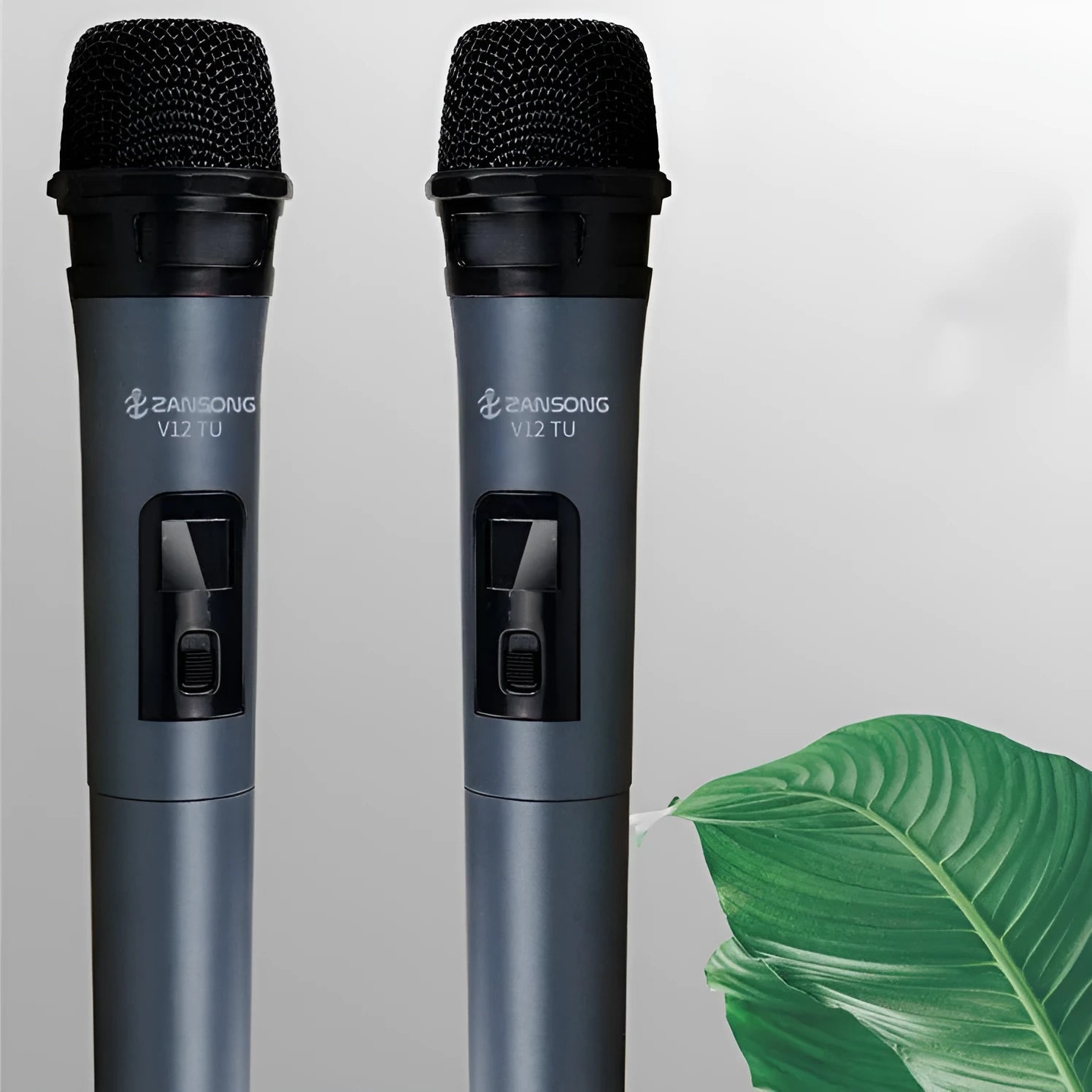 Black V12 dynamic handheld wireless microphone with USB receiver and audio cable.