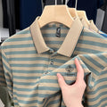 Man wearing a red and white mosaic striped short sleeve casual polyester top.