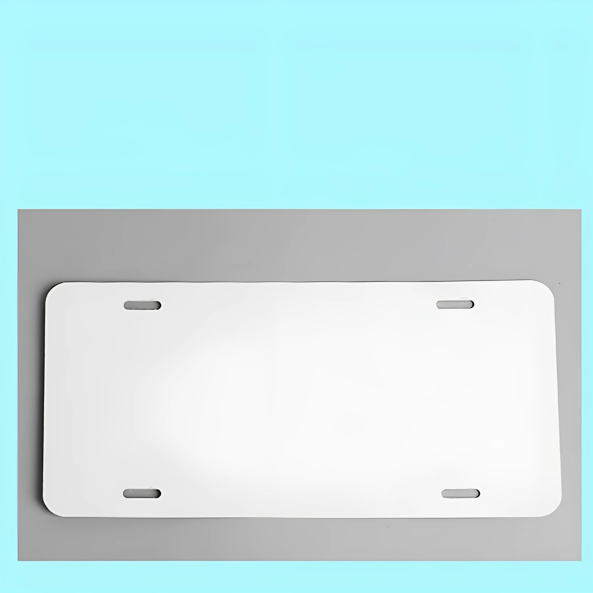 White aluminium car number plate blank measuring 30.3 by 15 centimetres.