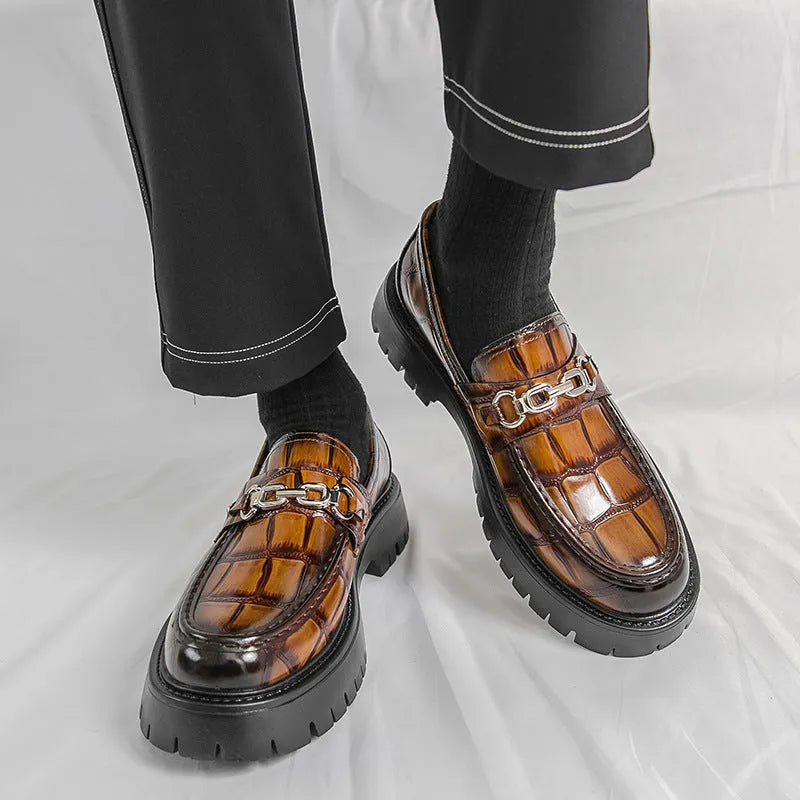 Men's crocodile print platform loafers in black, brown and yellow colours showing textured leather and flat heel design