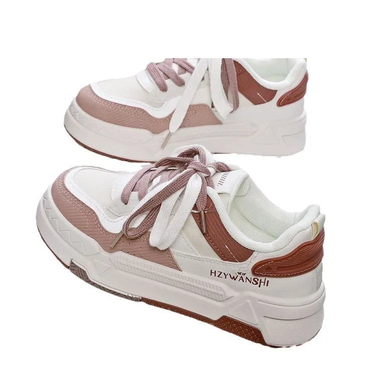 Beige children's lace-up board shoes with cross shoulder straps and a thick rubber sole, shown on a white background.