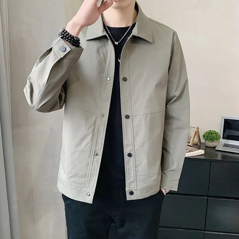 Men's Korean style single-layer lightweight jacket in blue grey, showing long sleeves and stitching detail.