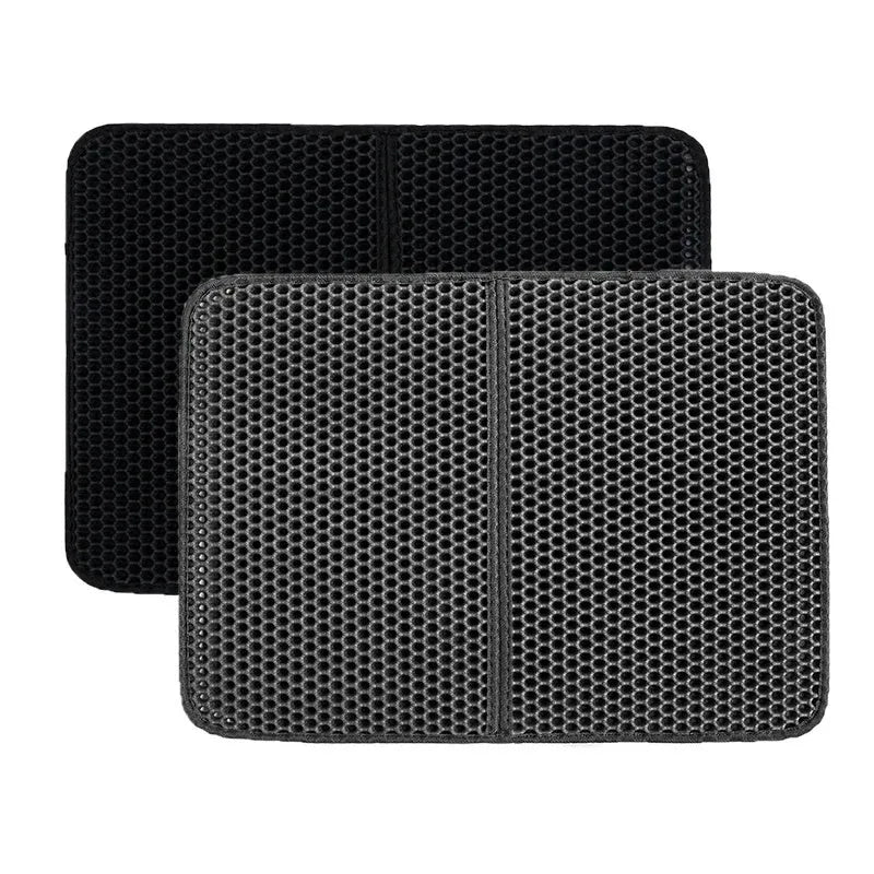 Black waterproof EVA cat litter mat with honeycomb surface for trapping litter, shown next to a litter box.