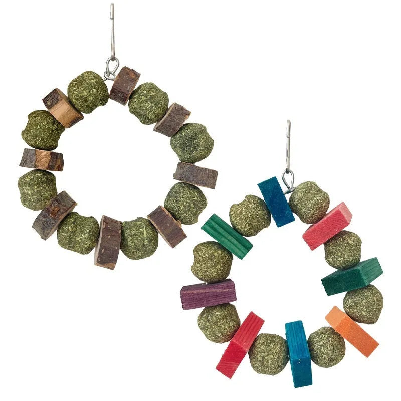 Hamster gnawing toy made of straw forming a ball ring, for small pets like guinea pigs.