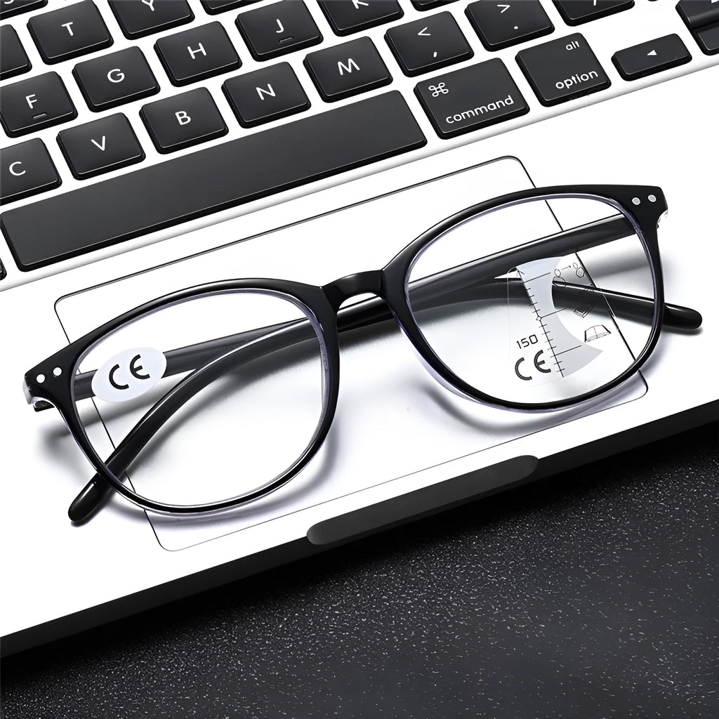 Women's ultra-light multi-focus presbyopic glasses in black and blue frame on a table.