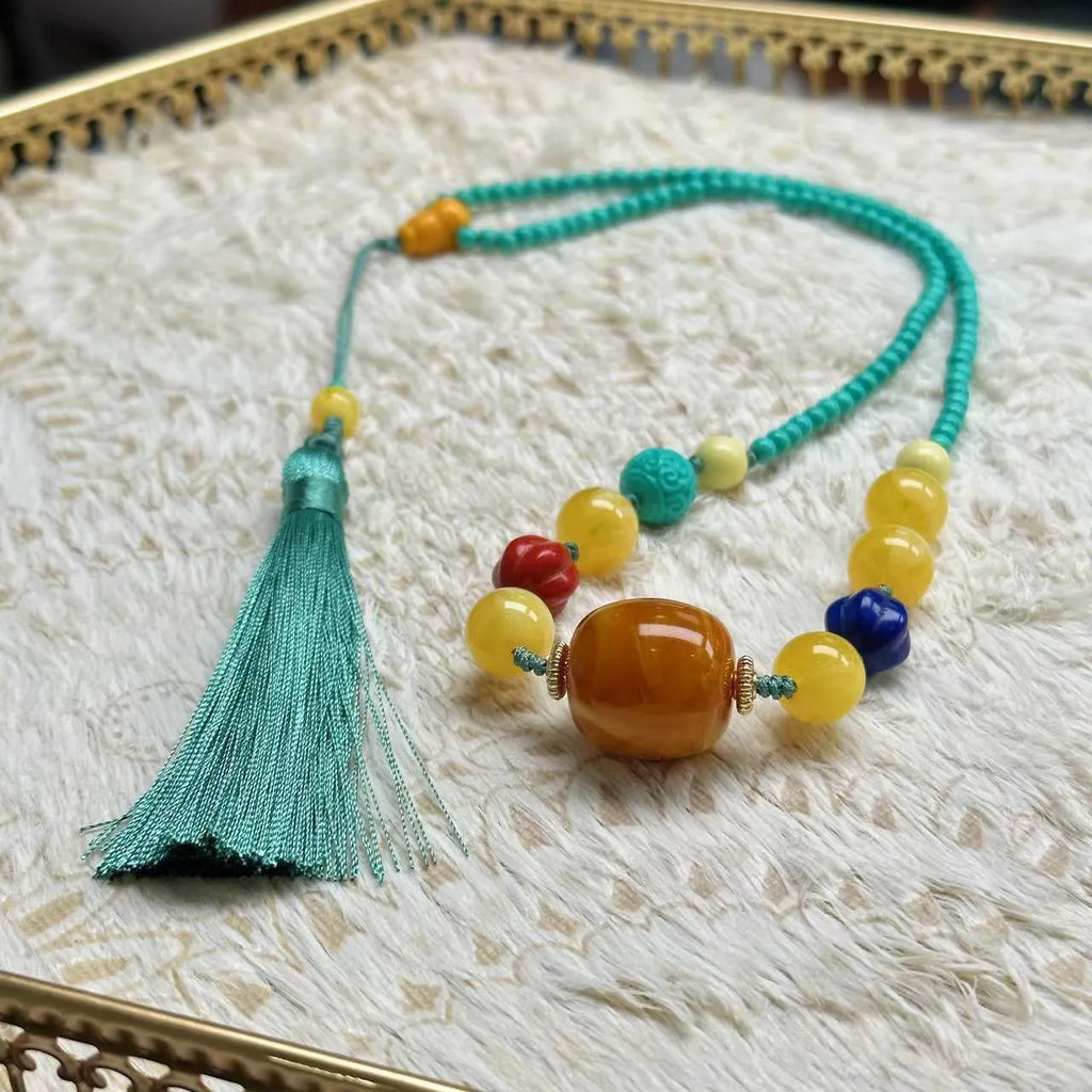 Turquoise stone mesh flower pendant on an adjustable ball bead necklace chain.