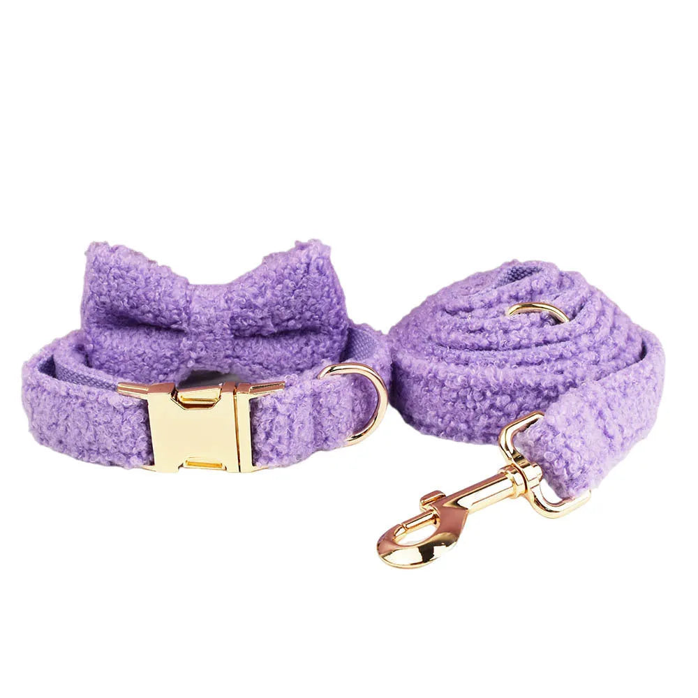 Purple cloth dog accessory set showing collar, leash, bow, and vest for small dogs