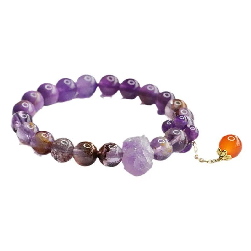Nine purple amethyst and red agate crystal bracelet showing 8mm beads and Mori style design