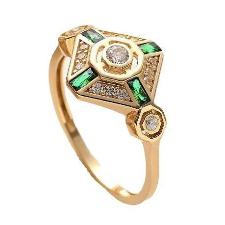 Square emerald-coloured gemstone ring for women on a plain background.