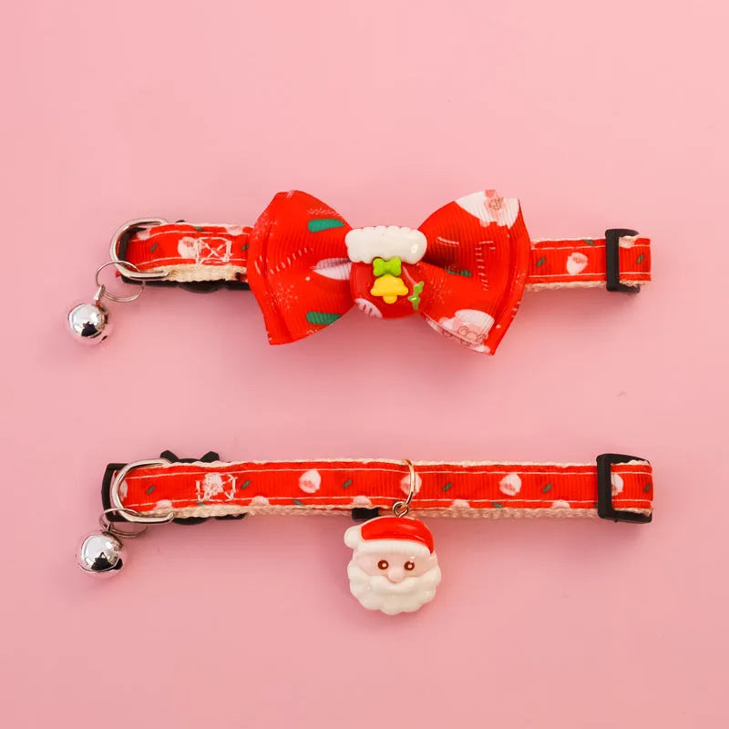 Christmas pet collar with bow tie, bell, and adjustable strap featuring Santa Claus and tree patterns