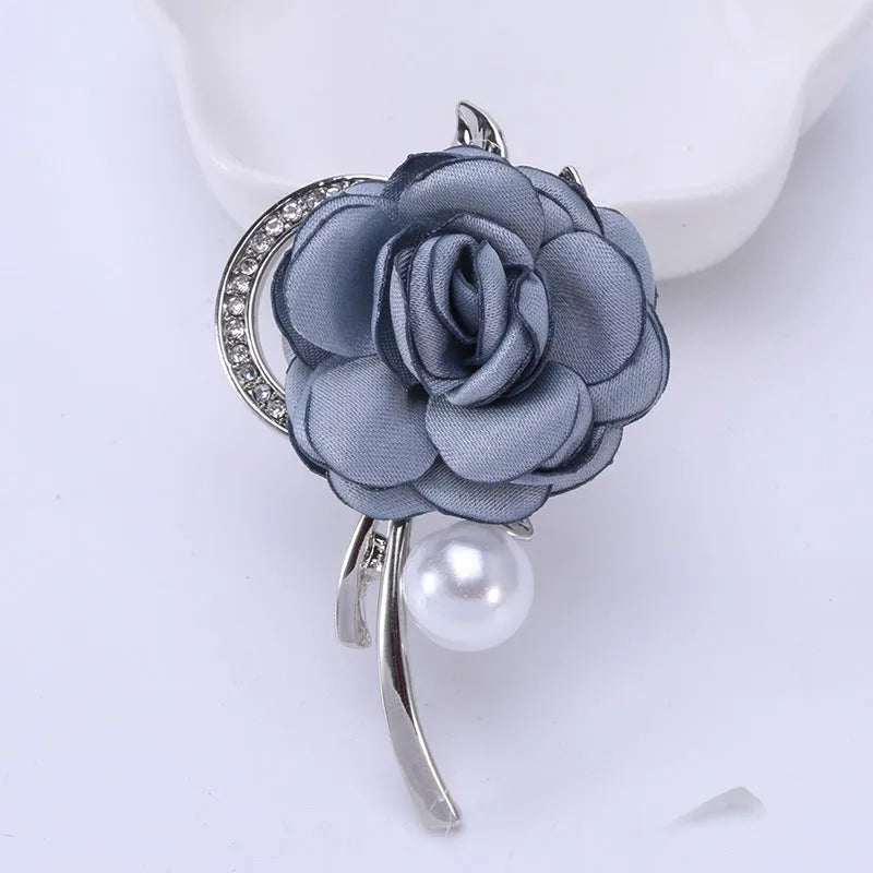 Rose brooch in Korean style, alloy construction, blue colour, 4.5cm by 3.8cm, on white background