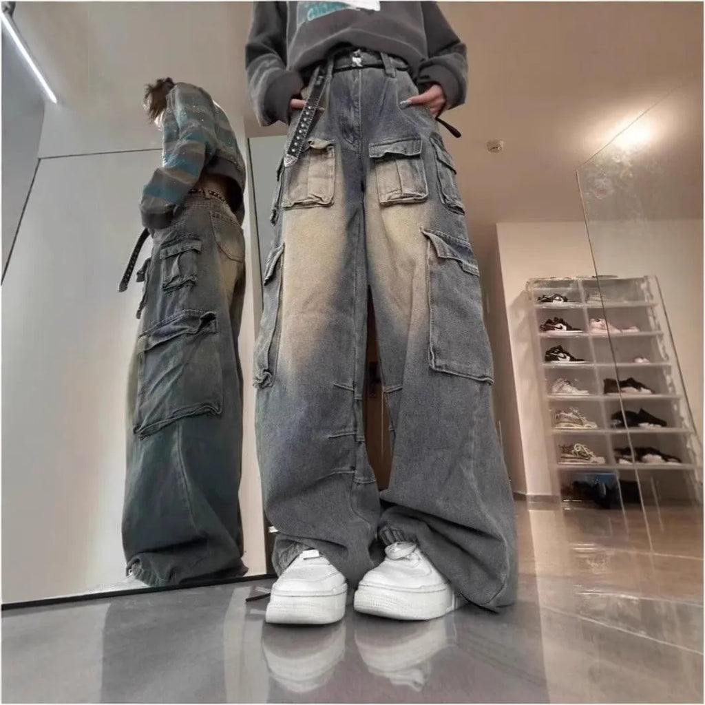 Men's light blue loose-fit distressed denim jeans with multiple pockets and straight-leg cut