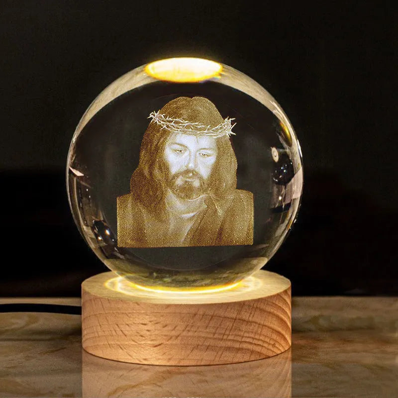 White crystal ball desk ornament on a wooden warm light base, showing purity-themed designs.