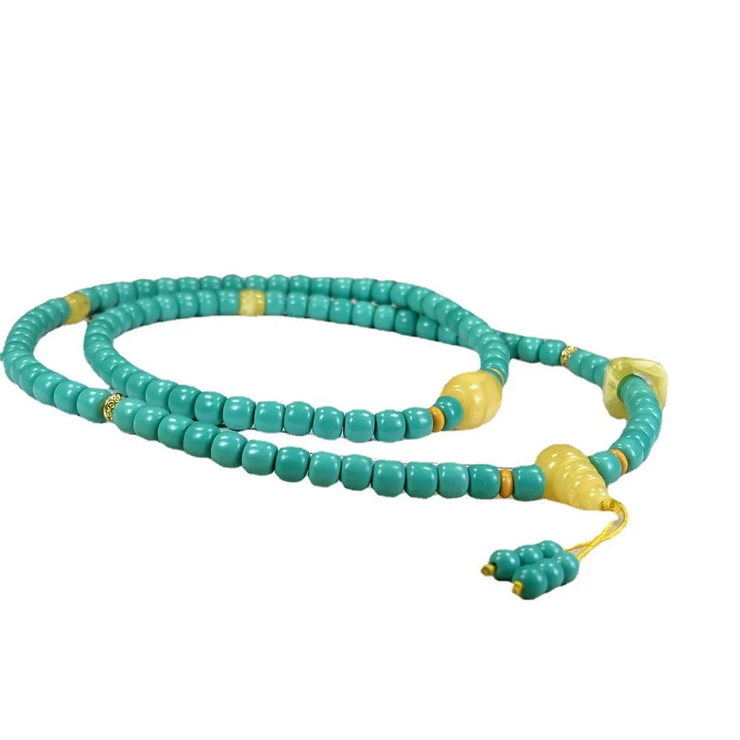Turquoise stone mesh flower pendant on an adjustable ball bead necklace chain.