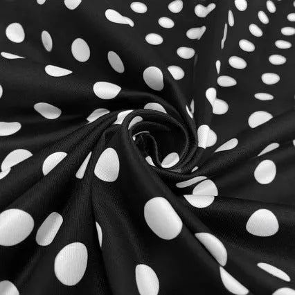 Women's multicolour polka dot dress with a square collar, short sleeves, and a pleated mid-length skirt.