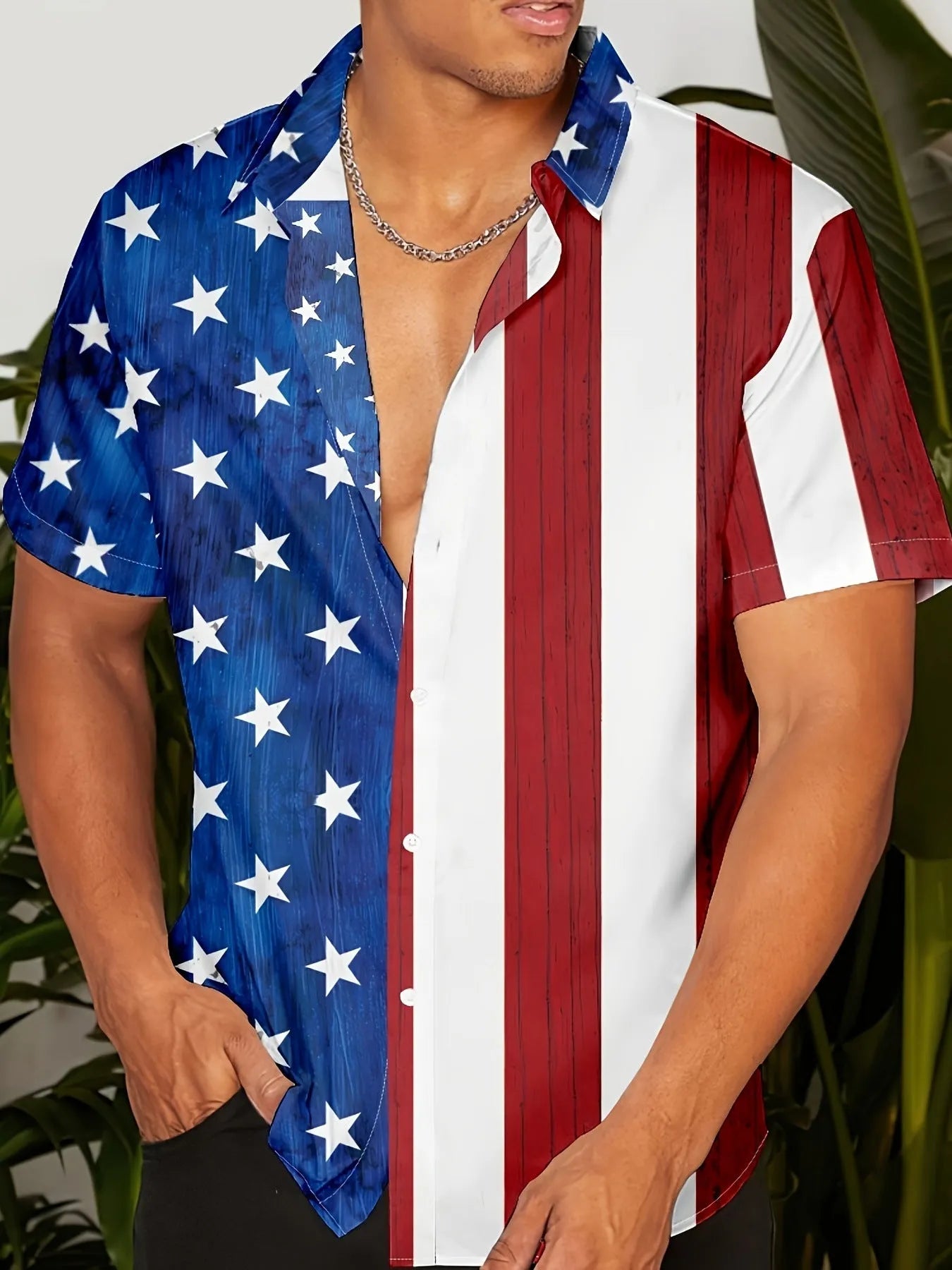 Man wearing a loose-fitting short sleeve shirt with a bold 3D floral print pattern.