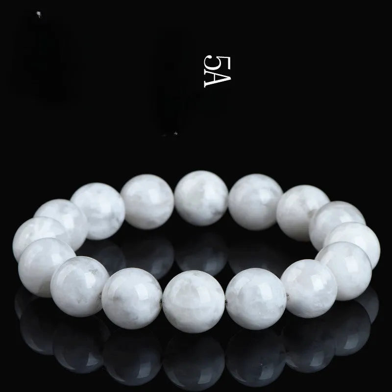 Women's crystal bracelet with round blizzard snowflake beads and traditional Ruyi and Xiangyun symbols.
