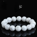 Women's crystal bracelet with round blizzard snowflake beads and traditional Ruyi and Xiangyun symbols.