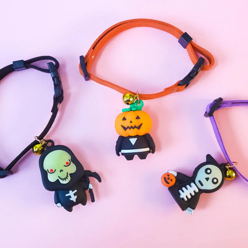 A polyester Halloween dog collar with a cartoon pattern, shown in Pumpkin Man, Luminous Kid, and Luminous Skull designs.