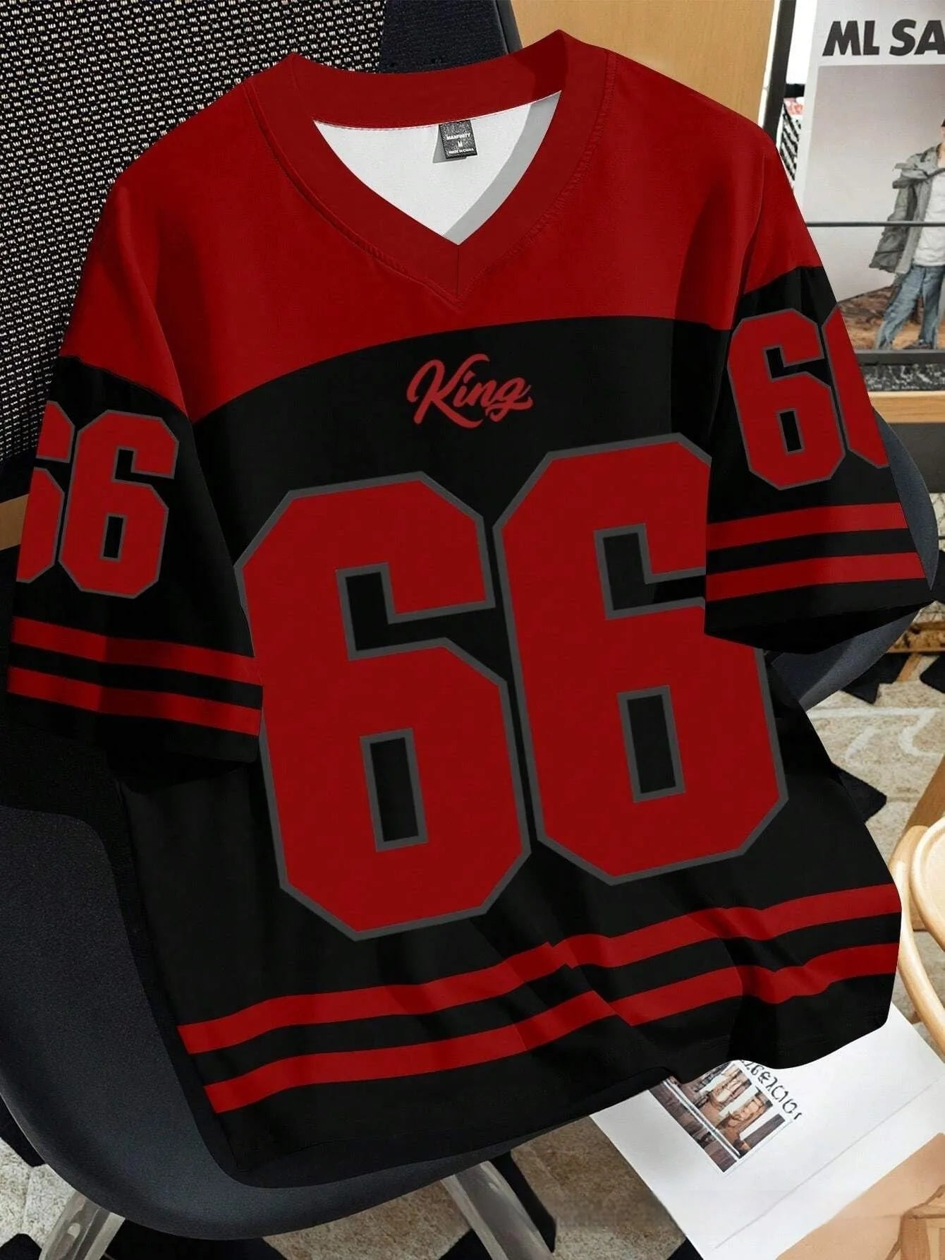 Man wearing a loose grey T-shirt with a 3D printed Chicago Bulls number 23 design on the front.